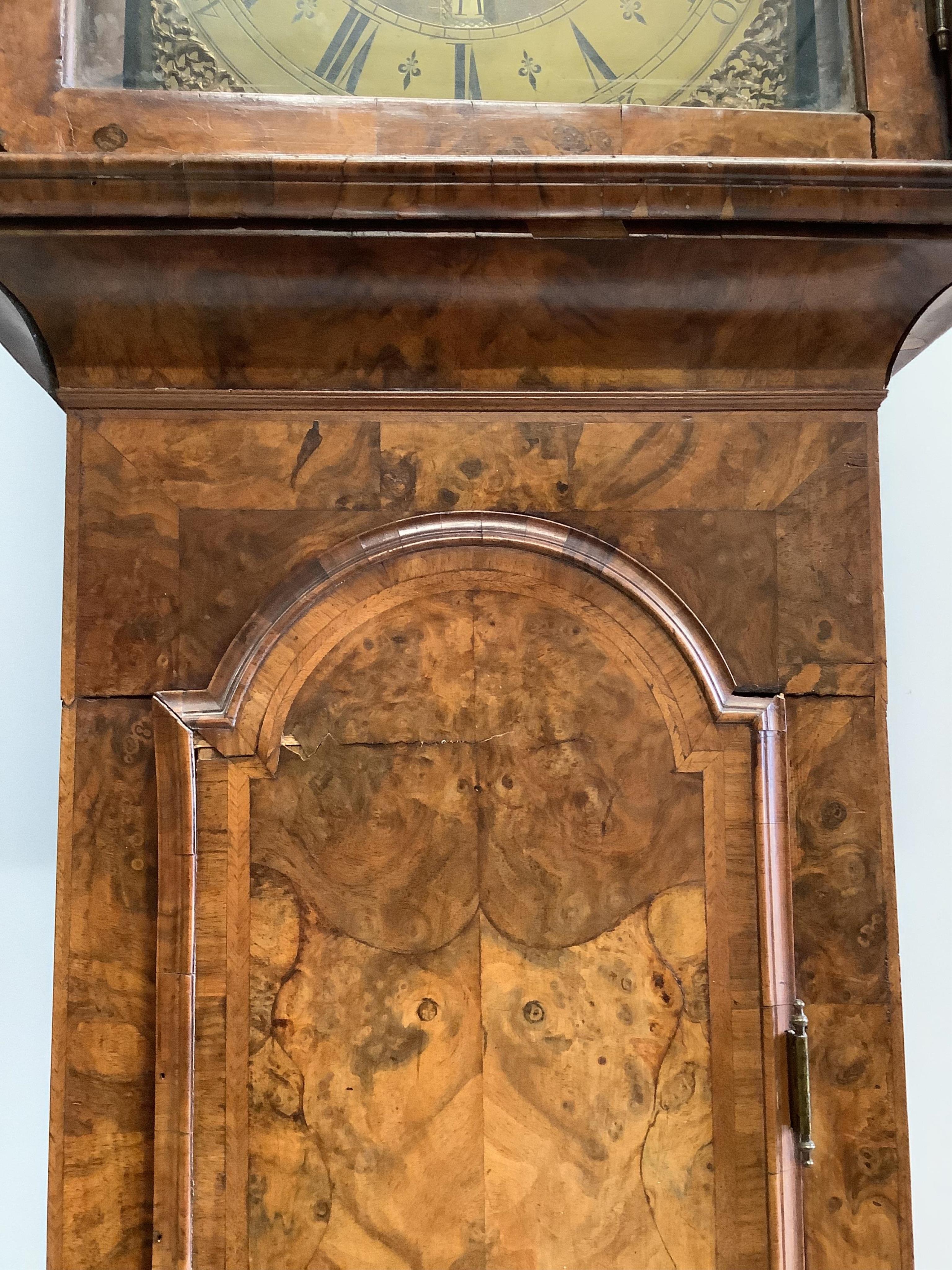 A George II walnut and feather banded longcase clock, Christopher Pinchbeck, London, height 237cm. Condition - poor